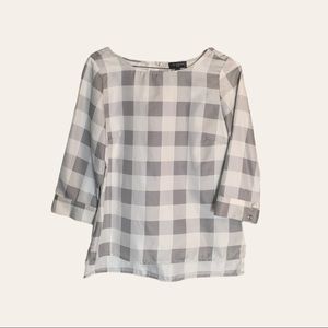 The limited PXS 3/4 sleeve gray and white checker blouse.